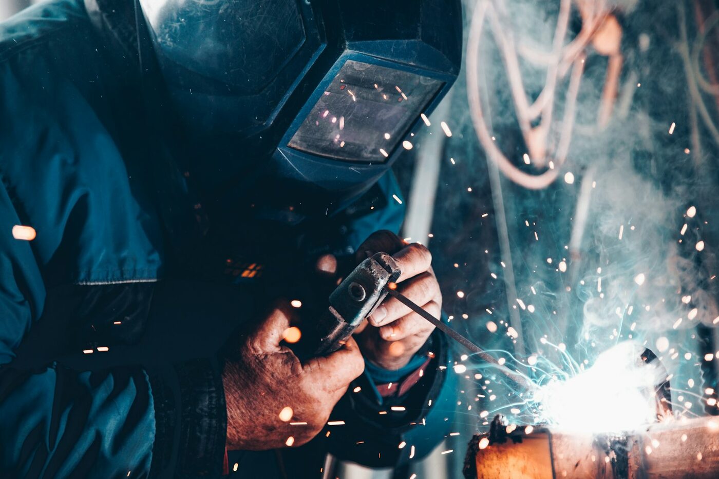 Welder at work with sparks flying