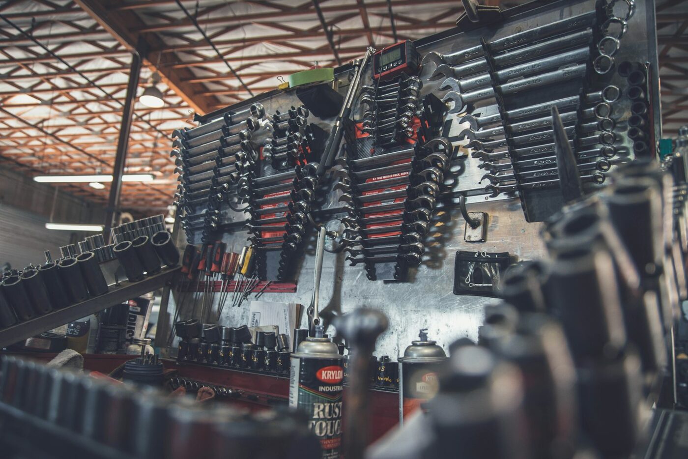 Rack of wrenches and hand tools in an industrial workshop